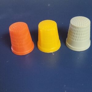 Three Plastic Thimbles